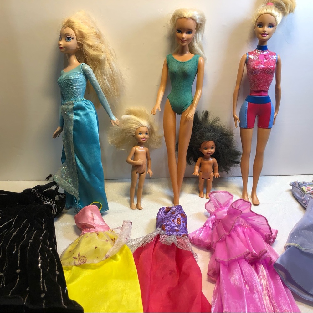 Lot of assorted Dolls and  clothing Elsa 2012, dolphin spin Barbie